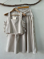 Load image in the gallery viewer,Conjunto de top e saia recortada ONDINE
