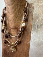 Load image in the gallery viewer,Colar curto multivoltas CONDOR
