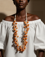 Load image in the gallery viewer,Model Black woman orange necklace Naftalina
