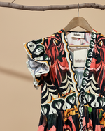 Carregar imagem no visualizador da galeria, Vestido midi print gráfico tropical com fundo de estúdio bege - detalhe
